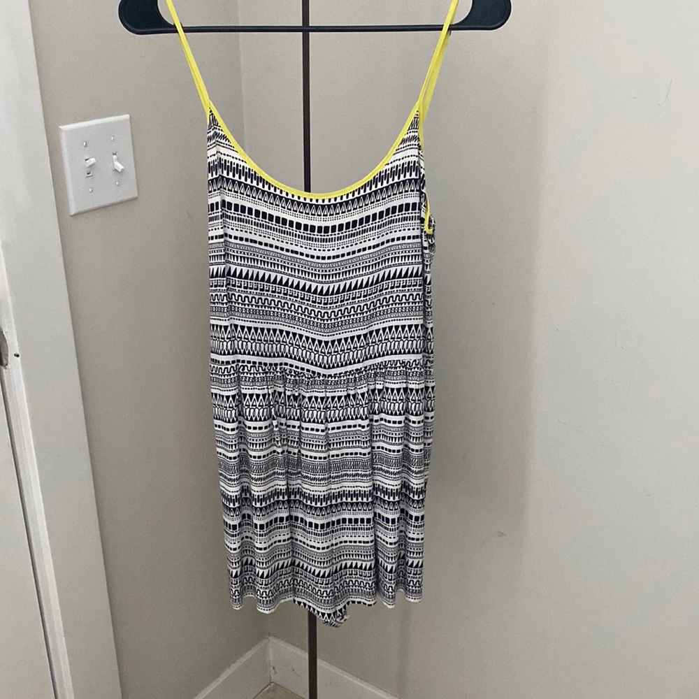 This item is a vintage geometric tribal print romper originally released by Aéro